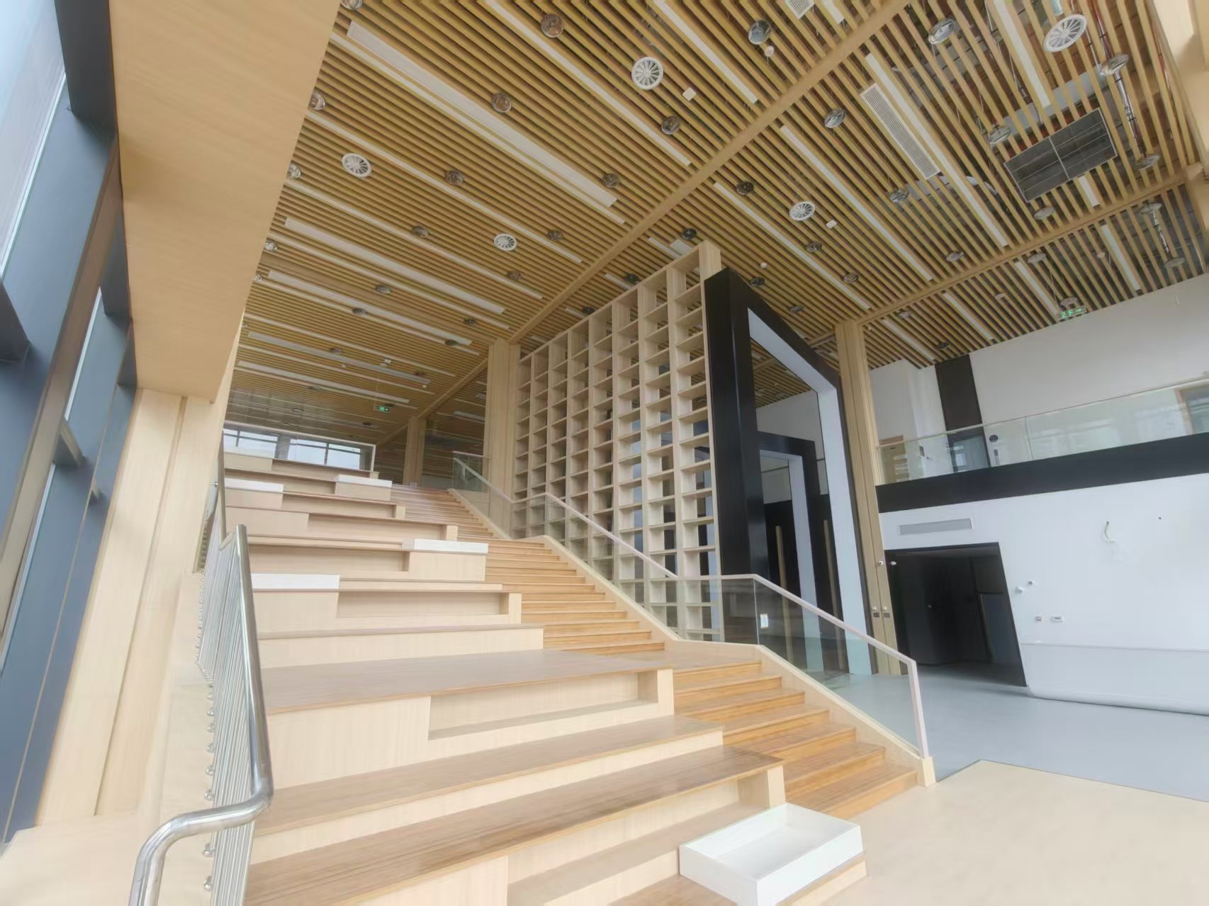 Interior bamboo staircase and double-height reading space